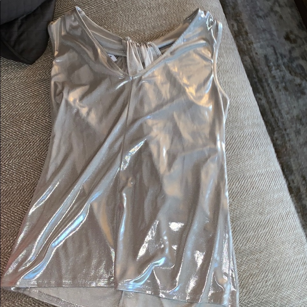 A chrome silver top with a unique back